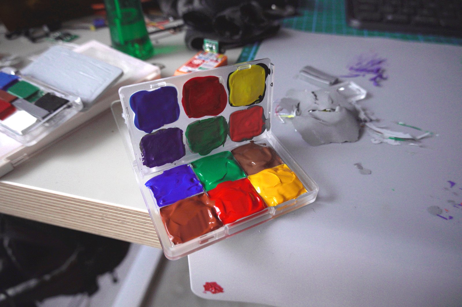Work surface with painted patches and palette