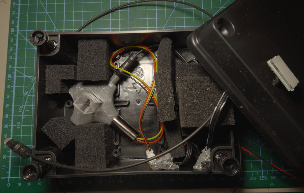 The Raman spectrometer enclosure with cuvette holder and optics