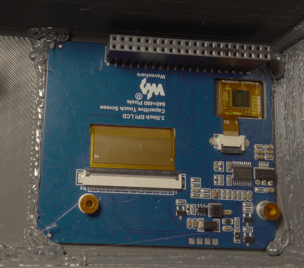 LCD display mounted and fixed in the 3D printed frame using PETG blobs