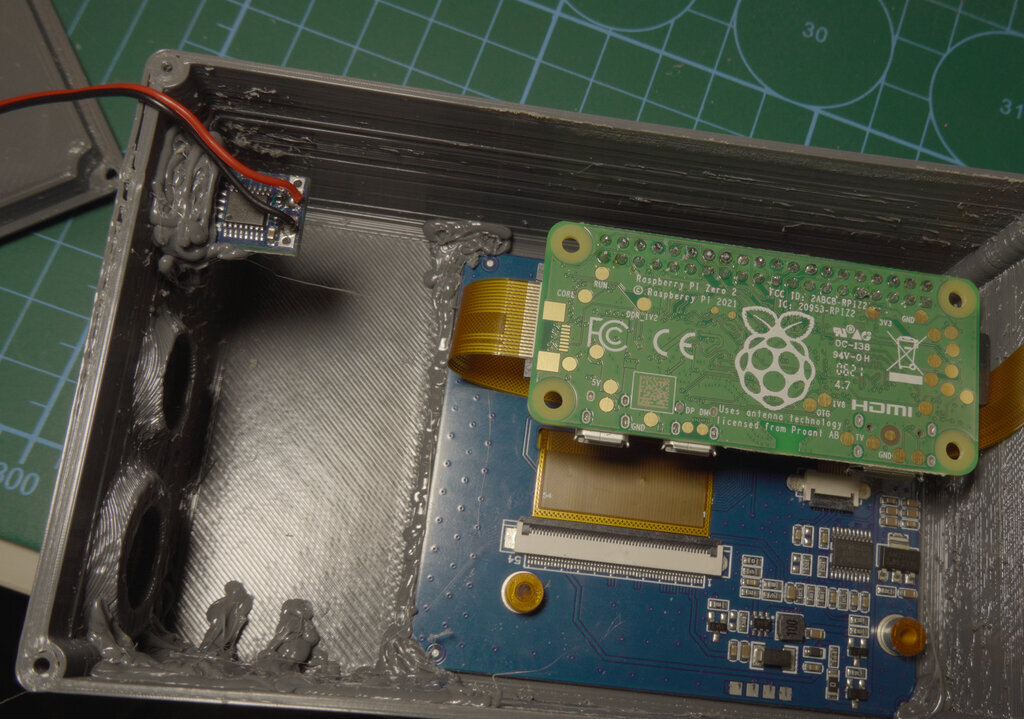 Raspberry Pi Zero 2 W and display fitted within the 3D printed frame