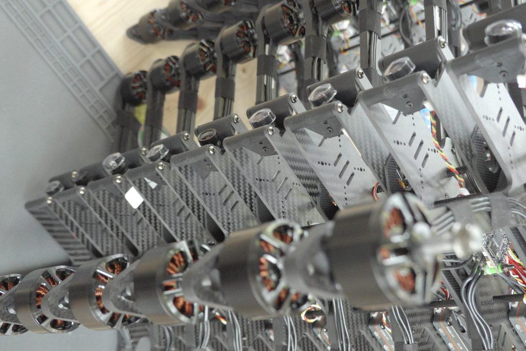 Rack of FPV drone frames at Dronefix.lt