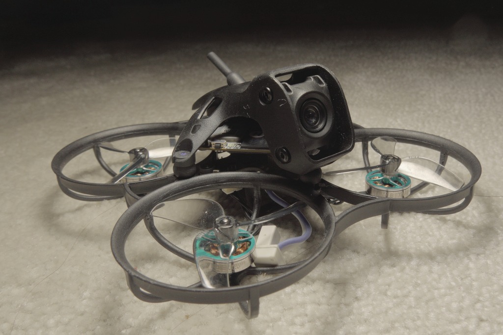Front close-up of the assembled Meteor75 Pro II showing the narrow-FOV DJI O4 camera in the Pro II canopy